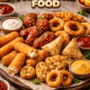 A crispy fried snacks platter by PAK N PURE FOOD featuring samosas, cheese sticks, onion rings, and wings – paknpure.com