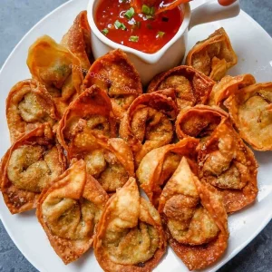 Crispy golden Fried Chicken Wontons filled with flavorful chicken, served as a delicious snack from www.paknpure.com.