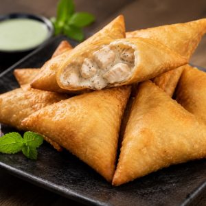 Golden crispy Rich Malai Boti Samosa filled with creamy malai boti chicken, a premium snack from www.paknpure.com.
